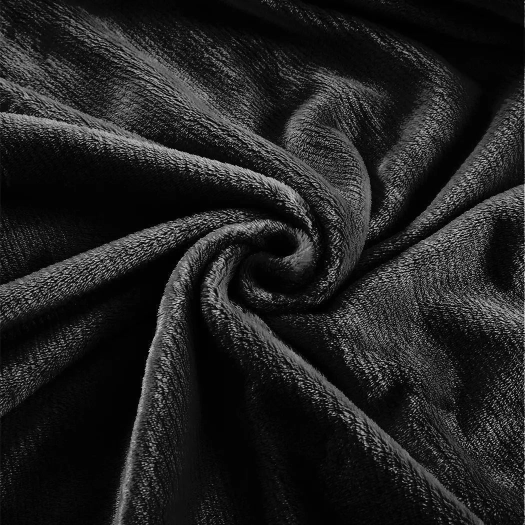 DreamZ 320GSM Ultra Soft Mink Blanket in Black, showcasing its plush texture and generous size, perfect for cozying up.